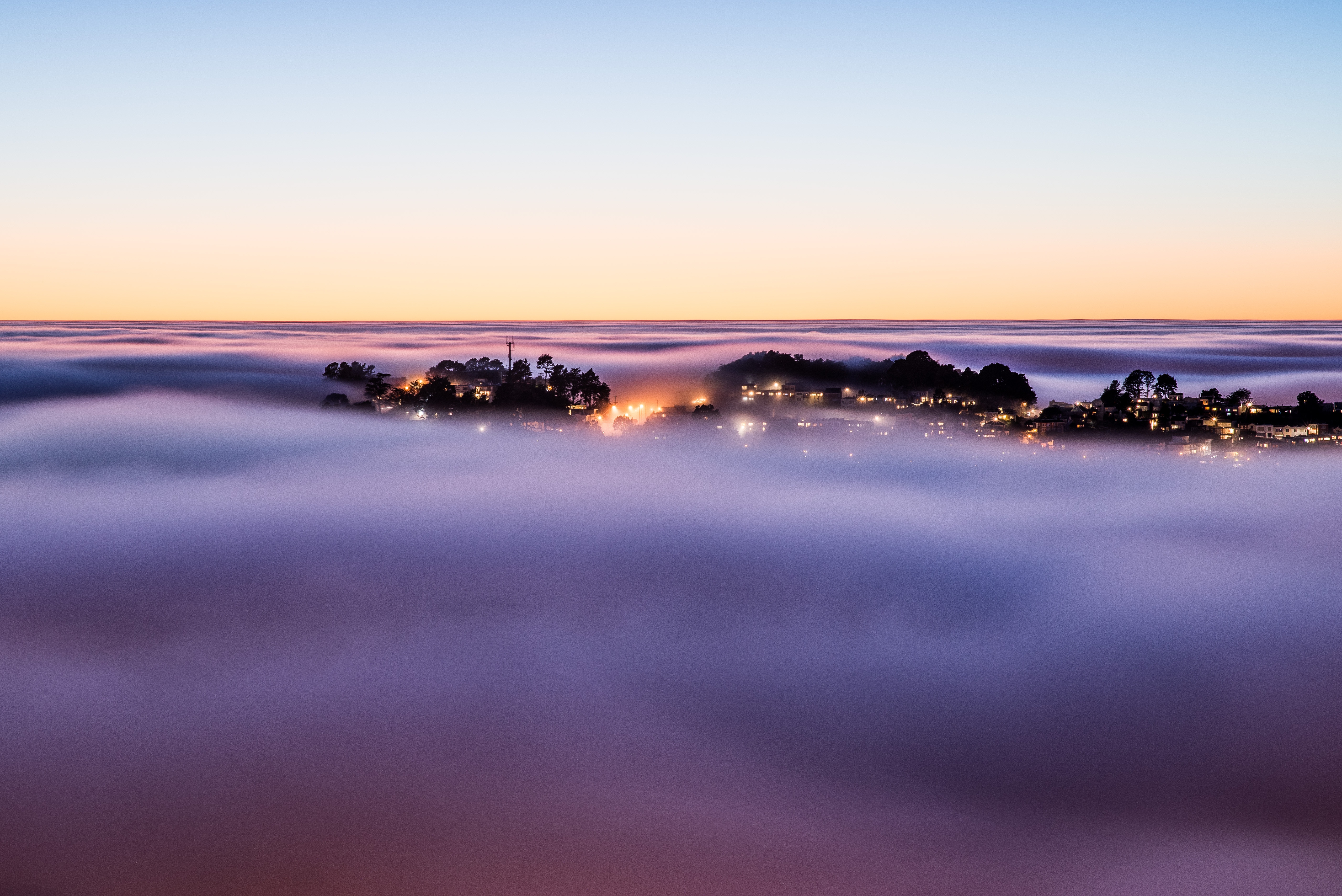 Green Grass And Fogg Under Purple Sky During Sunset Wallpapers