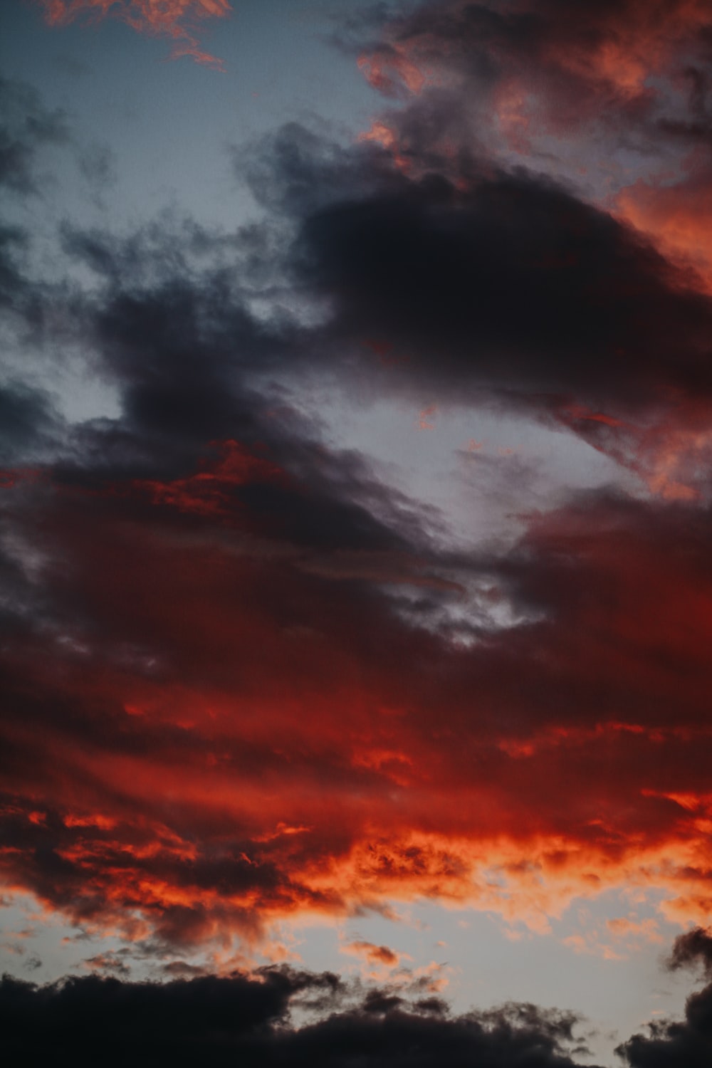Red Sunset And Dark Clouds Wallpapers
