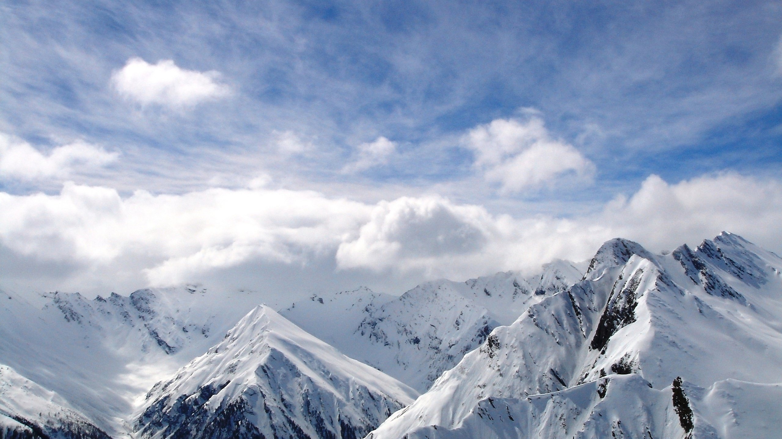 Snow Covered Mountains Under Black Cloudy Sky Wallpapers