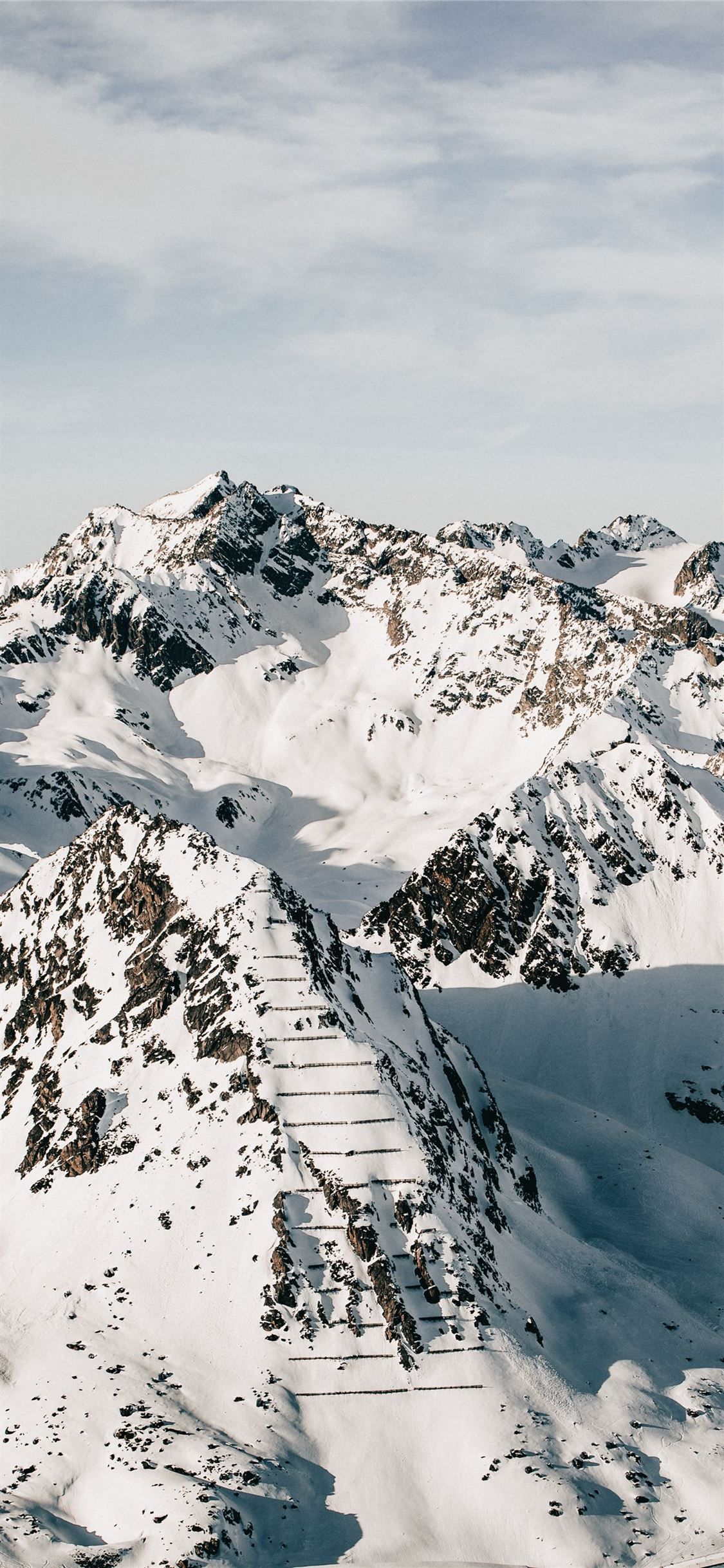 Snow Covered Mountains Under Black Cloudy Sky Wallpapers