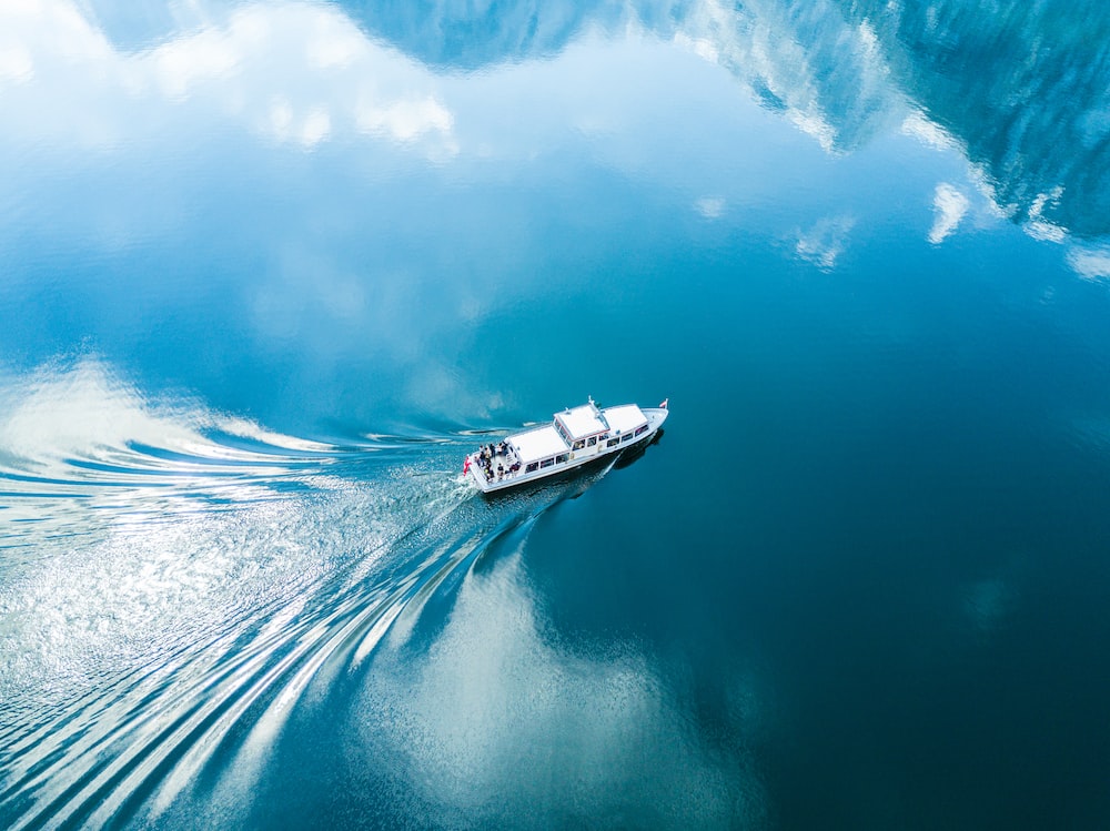 Boat In Blue Sea Water Wallpapers