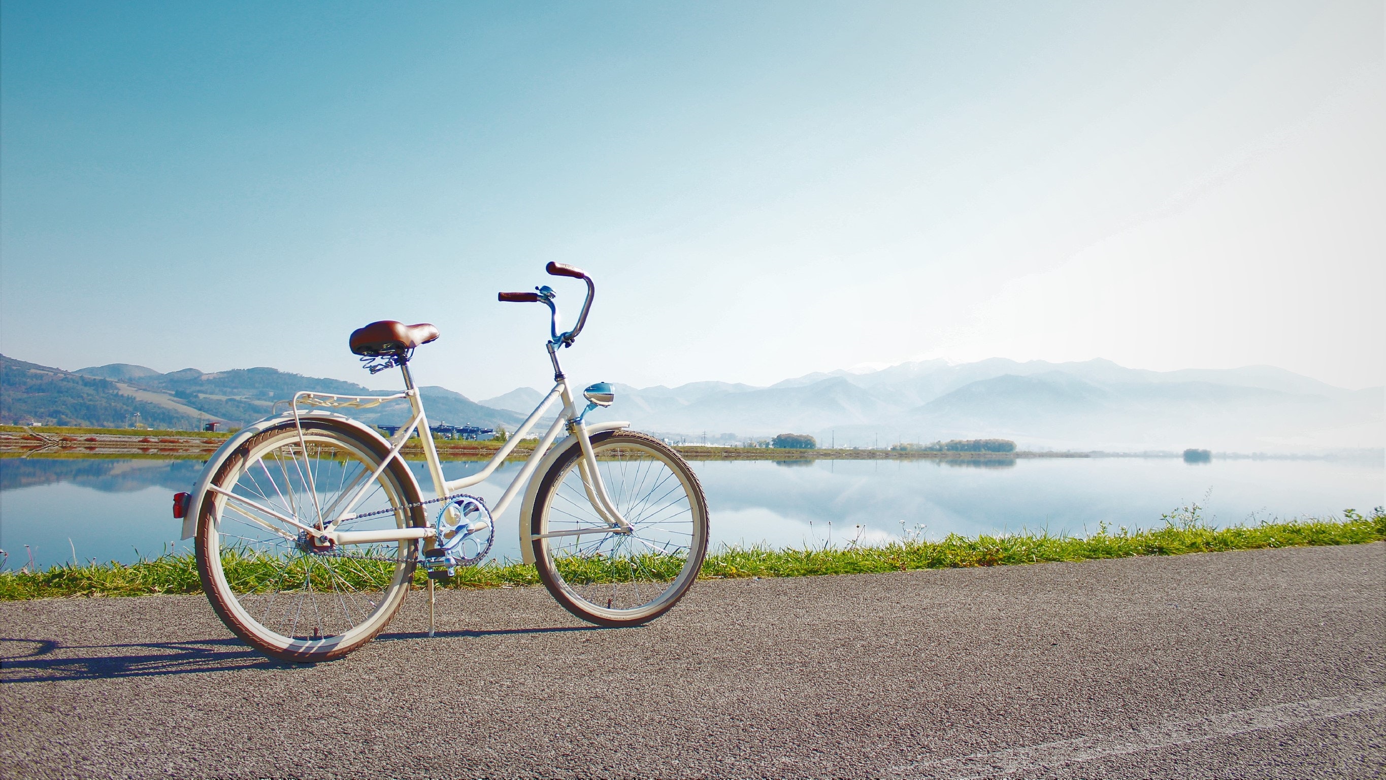 Girl Cycling Near Sea 4K Wallpapers