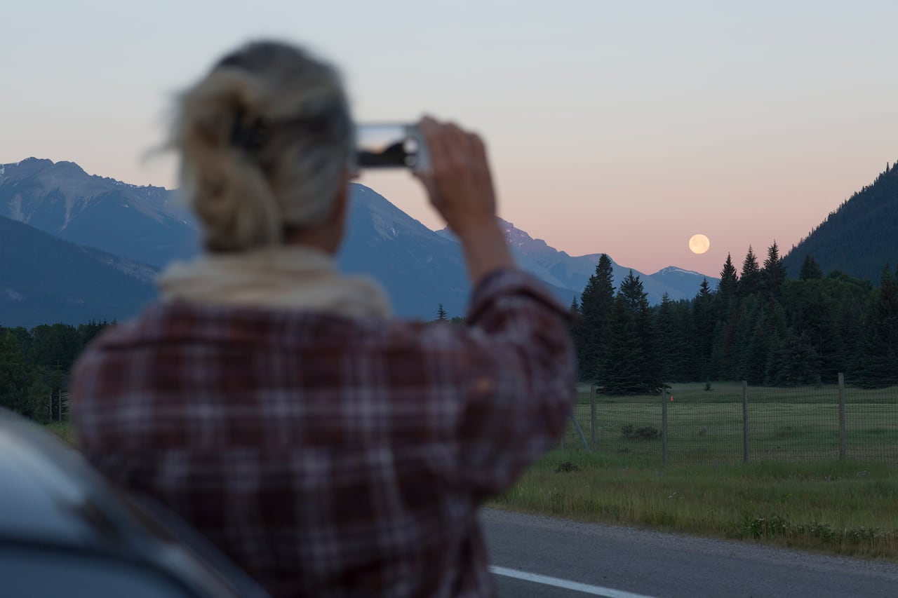 Man Watching Moon Rising Over Mountains
 Wallpapers